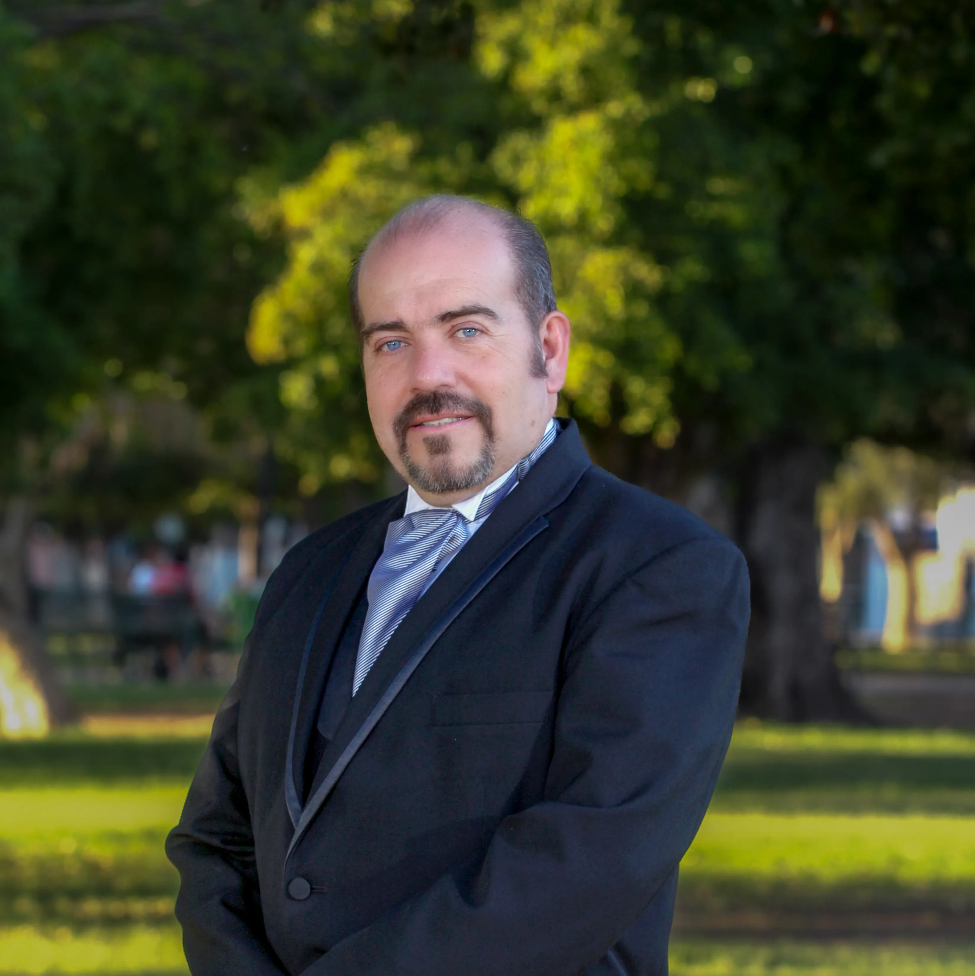 Dr. German Quiroga seated in his office