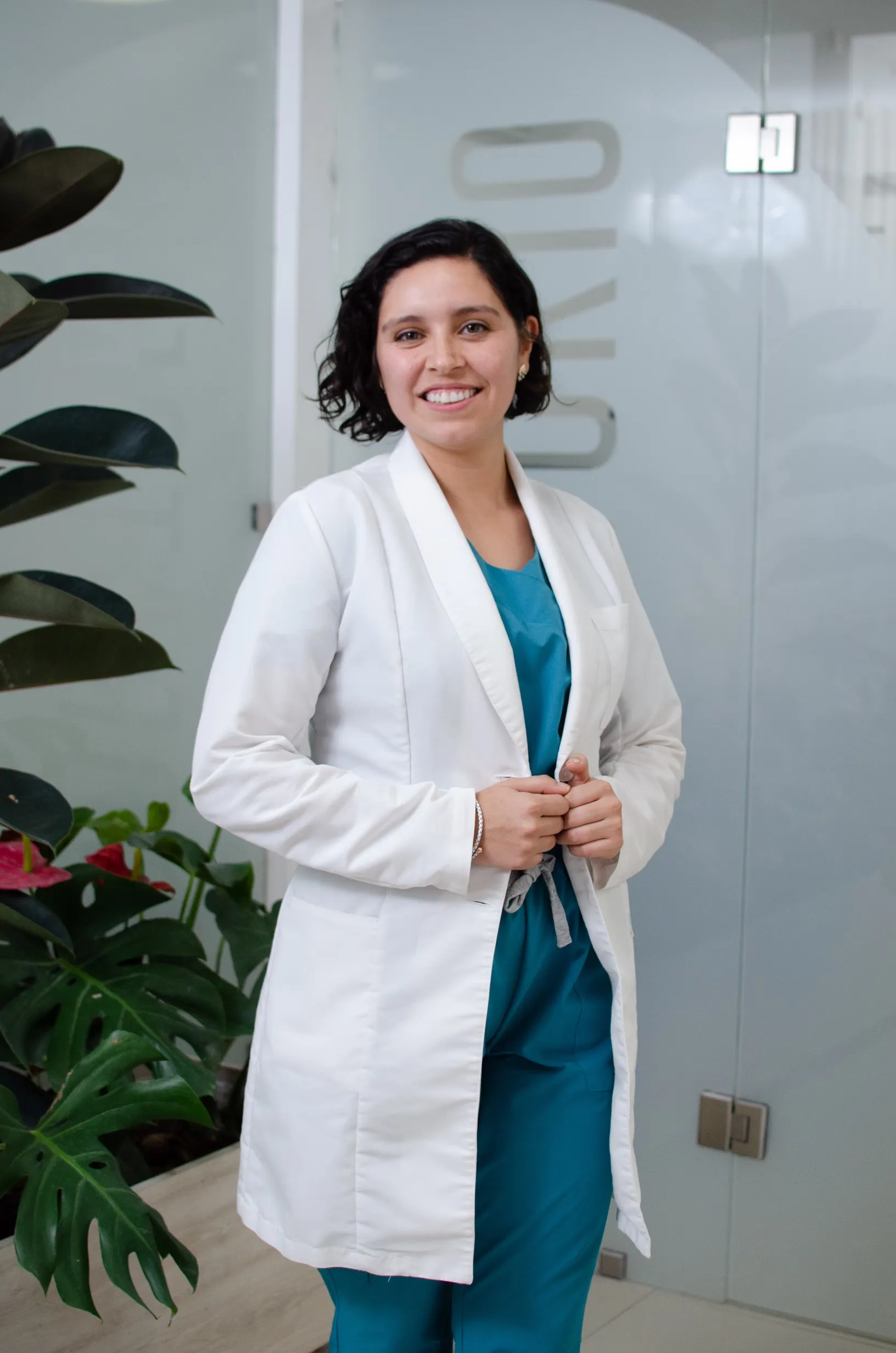 Biochemist Rocio Quiroga standing with a coatlab